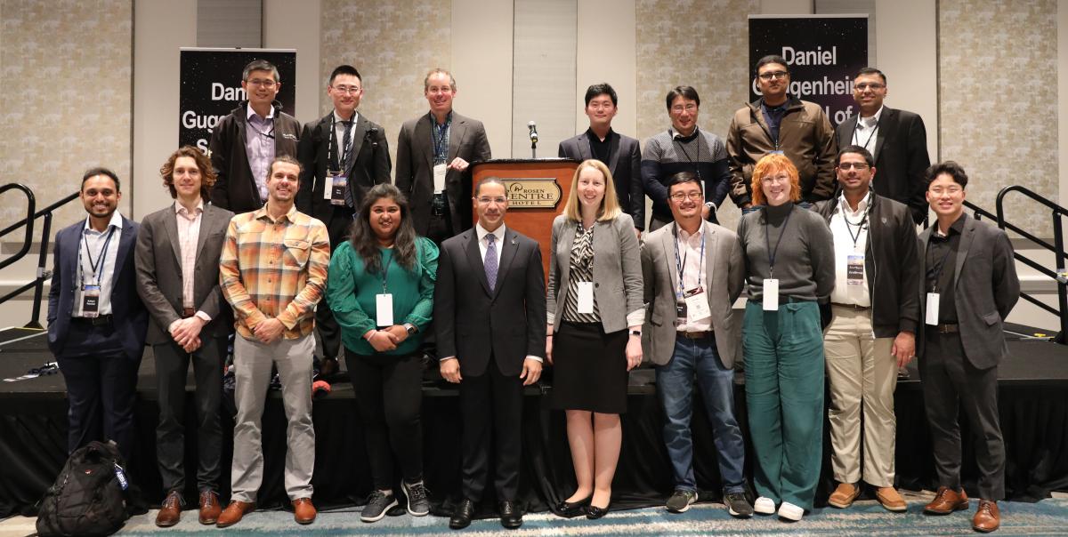 group of aerospace engineering alumni, students, and staff posing during the 2024 AE School Alumni Reception in Orlando, Florida
